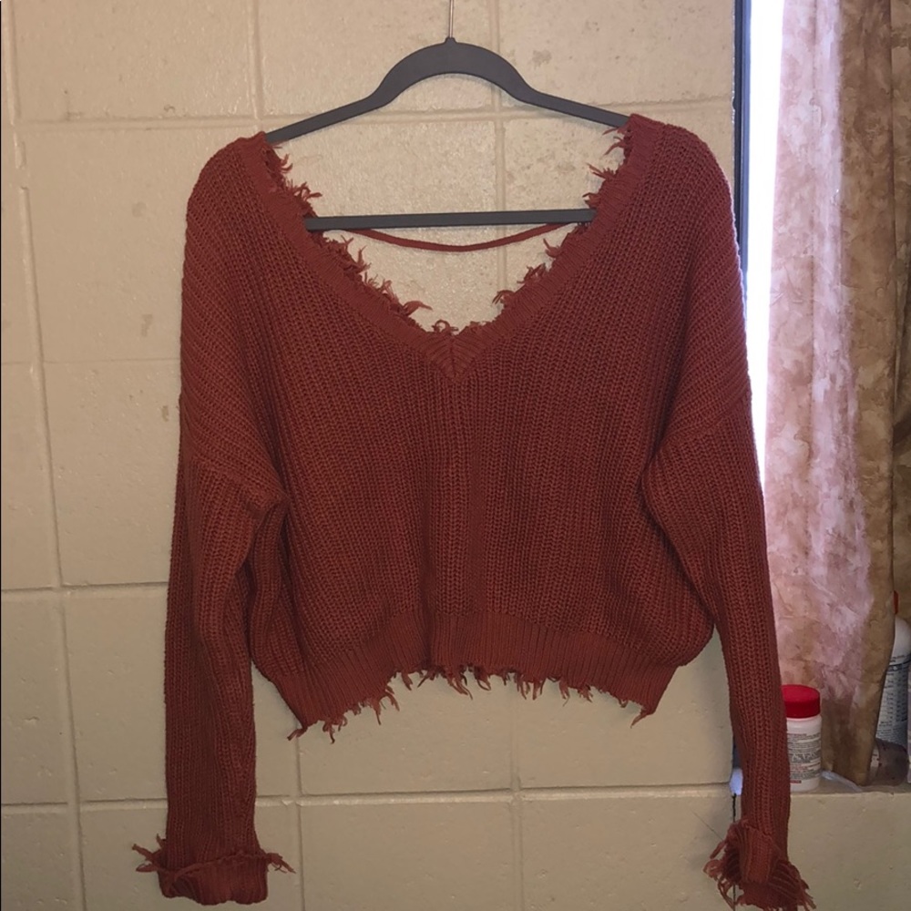 peach colored fringe sweater